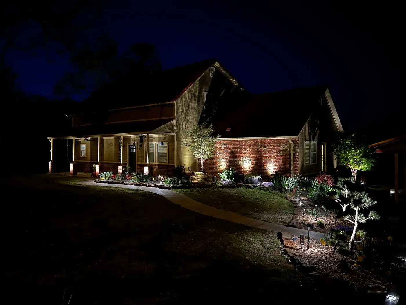Uplit trees over a brick drive